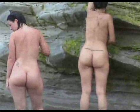 Two curvy Latina chicks expose their big asses on the nude ...