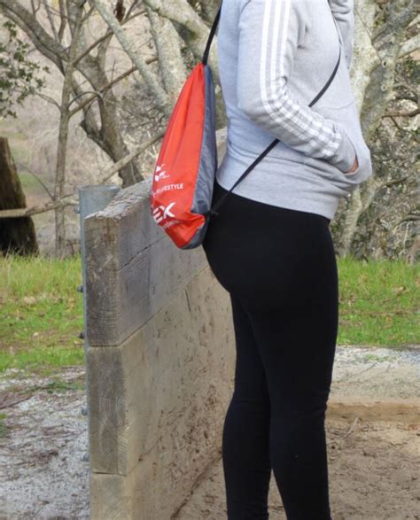 sexy young latina mild in black leggings with an onion ...